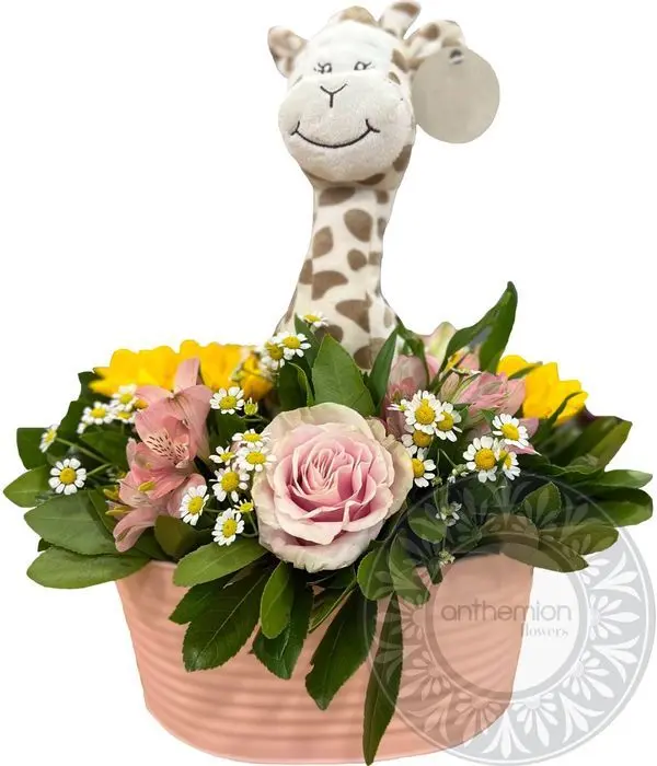 Pink flowers and toy in charming pink pot