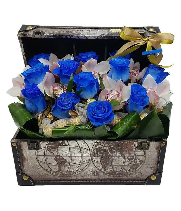 Blue roses,orchids and chocolates in a chest