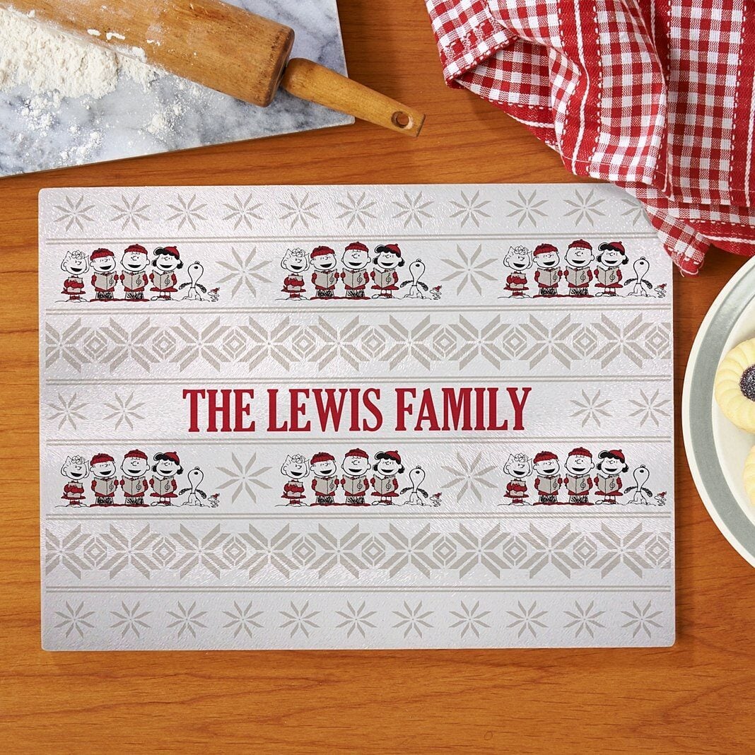 PEANUTSÂ® Classic Caroling Glass Cutting Board