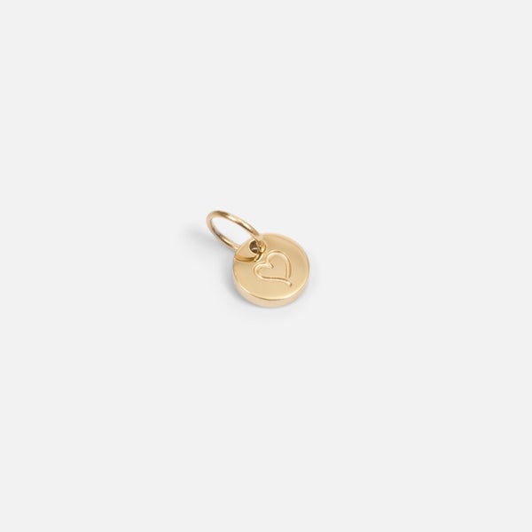 Small symbolic golden charm engraved "heart"