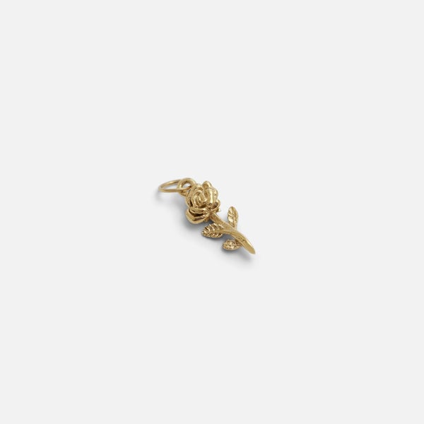 Small golden flower charm