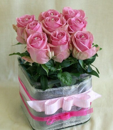 Swarovskis pink roses in a glass cube