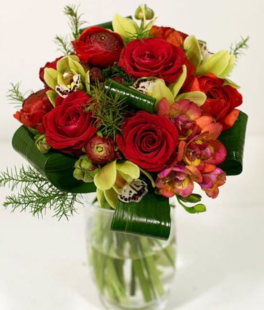 Spherical bouquet of red roses and orchids