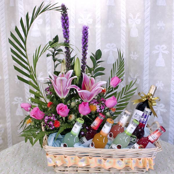 Red French Wine With Fruit Juice In Glass Bottle And  Mixed Flower