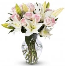 Pink Roses And White Lilies In A Vase