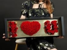 Red Roses Arranged In A Golden Black Box