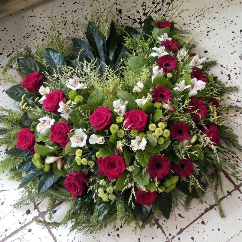 Memorial wreath with red roses