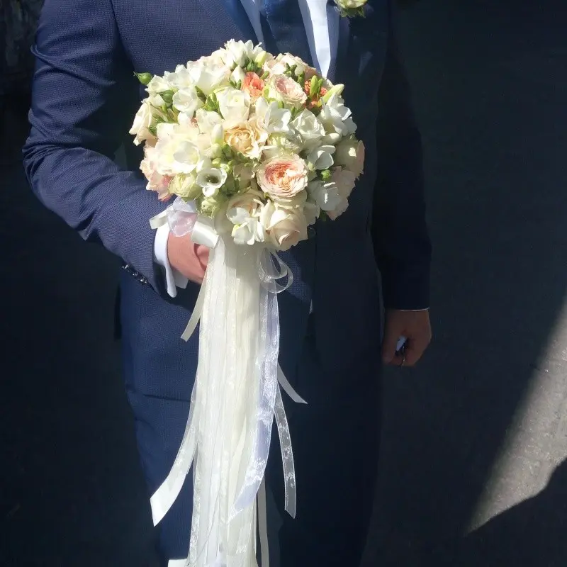 Bridal bouquet of light colour flowers