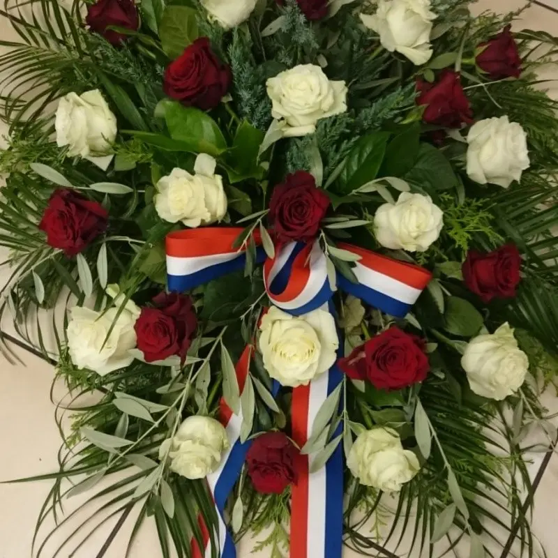 Funeral wreath with white and red roses