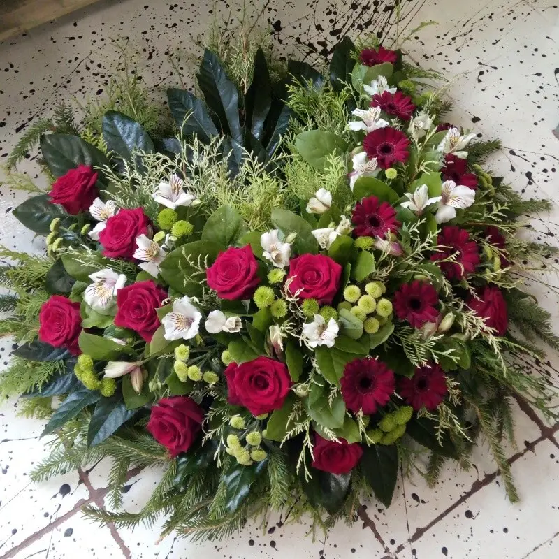 Memorial wreath with red roses