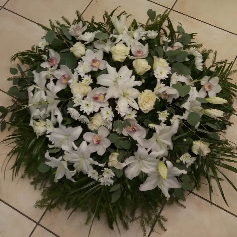 Funeral wreath with various white flowers