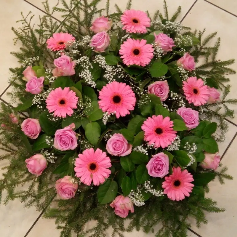 Furneral wreath with pink flowers and roses