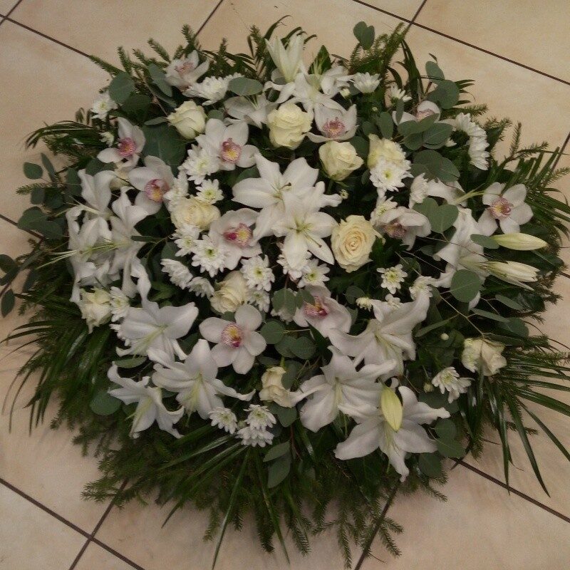 Funeral wreath with various white flowers