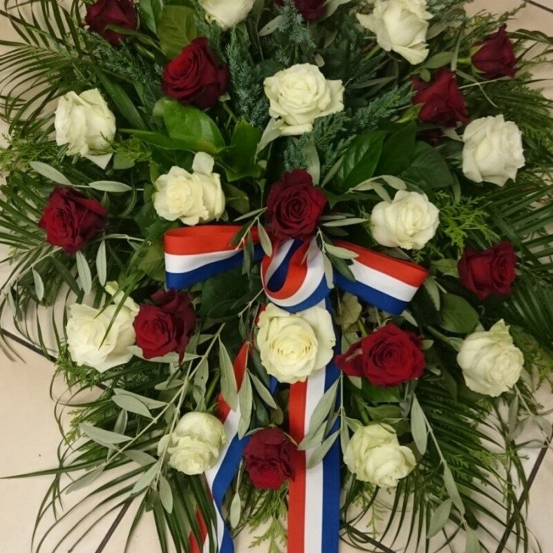 Funeral wreath with white and red roses