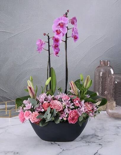Blushing Pink Flowers in a Boat Vase
