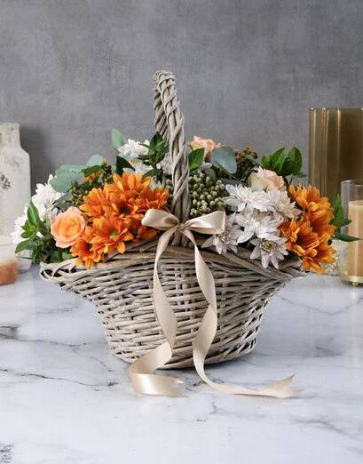 Peach Roses And Sprays In A Basket