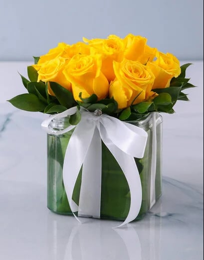 Yellow Roses In A Small Square Vase