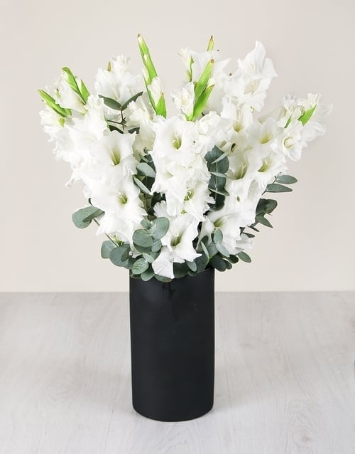 White Gladiolus in Chalk Board Vase