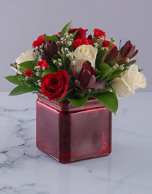 Vase of Red and Cream Roses