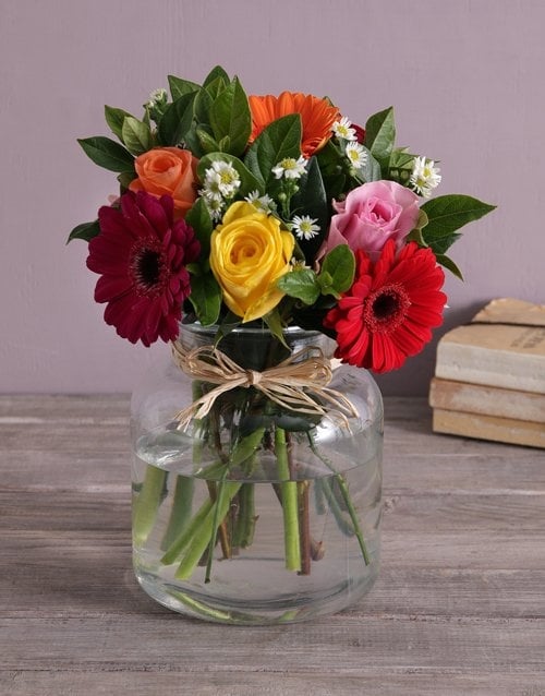 Mixed Flowers In A Glass Urn