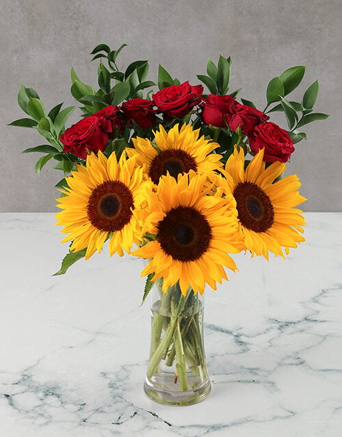 Sunflowers and Red Roses in Glass Vase