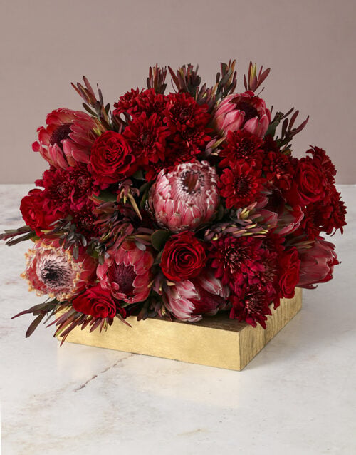 Ravishing Red Roses and Proteas
