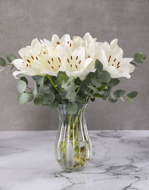 White Asiflorum Lilies In Ribbed Vase