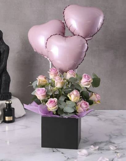 Lilac Roses And Balloon In A Black Box