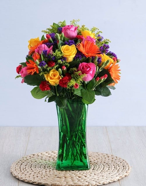 Colourful Blooms In Green Vase