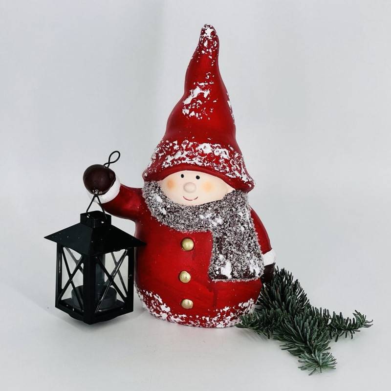 Christmas,souvenir,candlestick,boy,in,red,dress,with,lantern