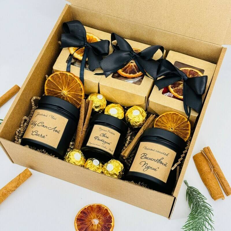 A,gift,set,of,tea,with,Ferrero,Rocher,chocolates,,nuts,,and,a,candle,in,a,handmade,jar.,Gift
