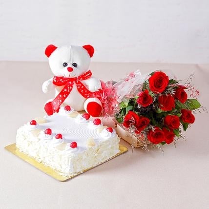 Tutti frutti Adorable Love Combo (12 Red Roses, 1/2 Kg Pineapple cake & 6 Inch Teddy)