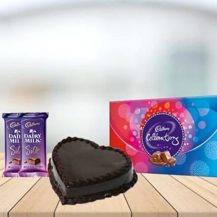 Heart Chocolate Cake with Assorted Chocolates Combo (1/2 kg Heart Chocolate Cake With Cadbury Celebration and 3 Cadbury Dairy Milk Silk (60 gm))