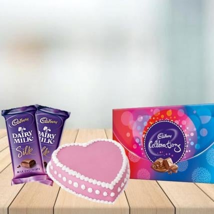 Heart Strawberry Cake with Assorted Chocolates Combo (1/2 kg Heart Strawberry Cake With Cadbury Celebration and 3 Cadbury Dairy Milk Silk (60 gm))