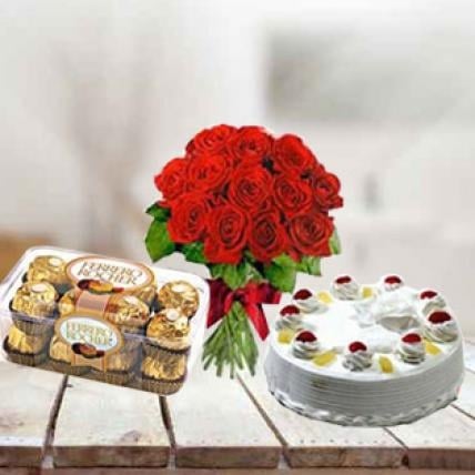 Cake, Flowers and  Chocolates (1 Kg Pineapple Cake, 12 Red Roses, 16 pc Ferrero Rocher)