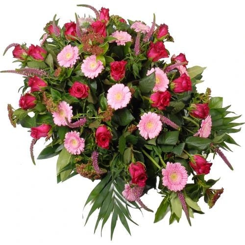 Funeral arrangement with pink roses in gerberas (Oval pink funeral arrangement approx 75cm with roses and gerberas among others)