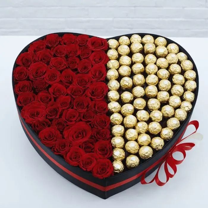 Box of red roses with ferroro