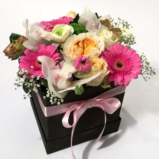 Stylish giftbox with pink and creamy flowers