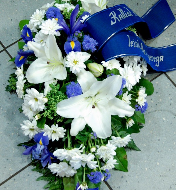 Funeral arrangement: white lilys, chrysanthemum, iris
