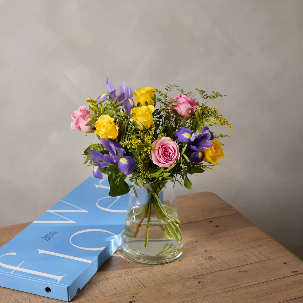 A joyful bouquet of yellow and pink roses