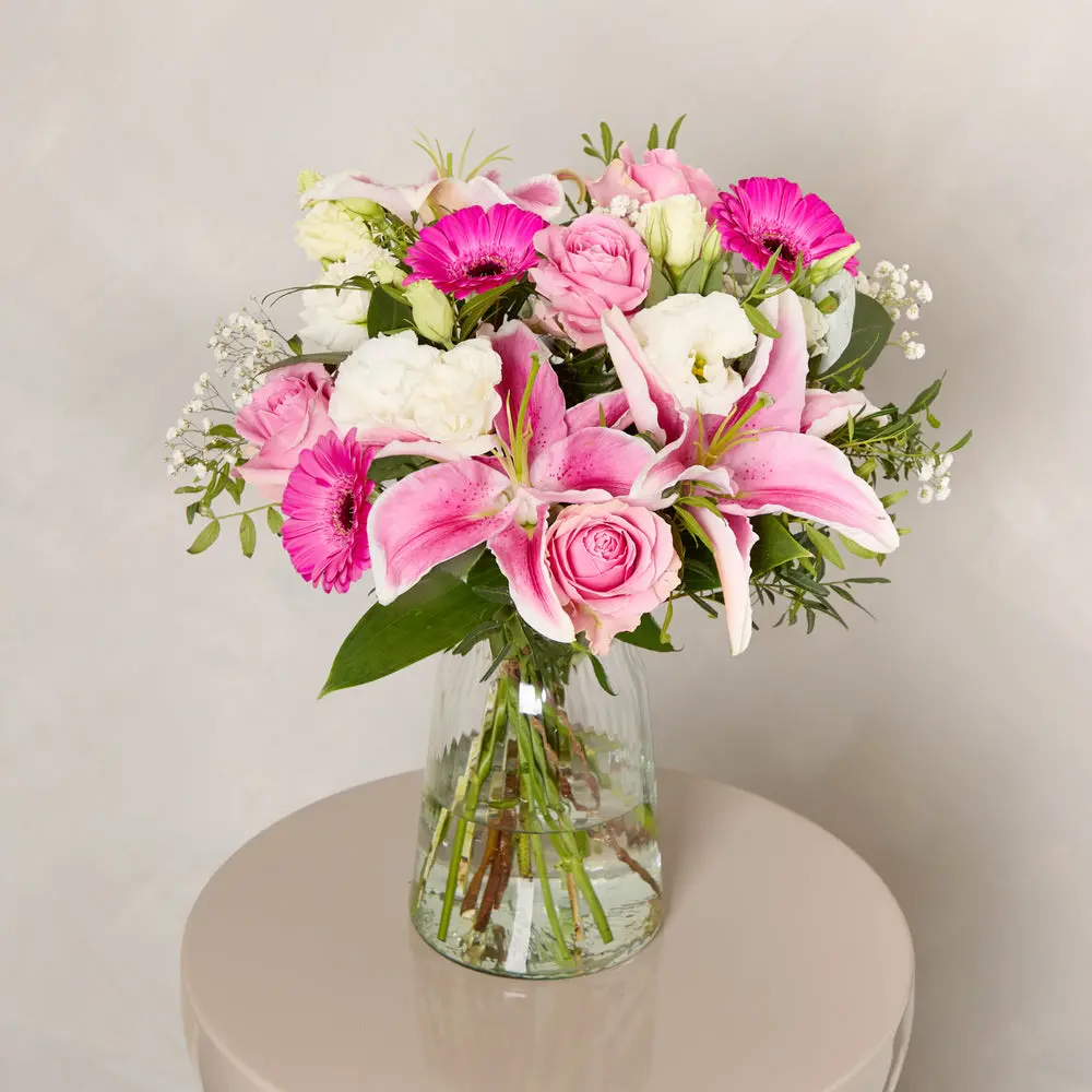 Vibrant pink lilies and roses