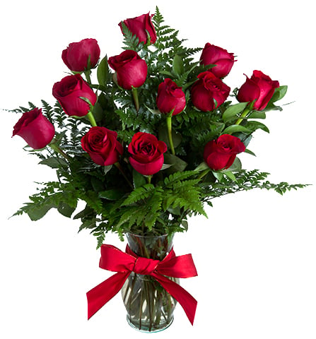 One dozen roses in glass vase