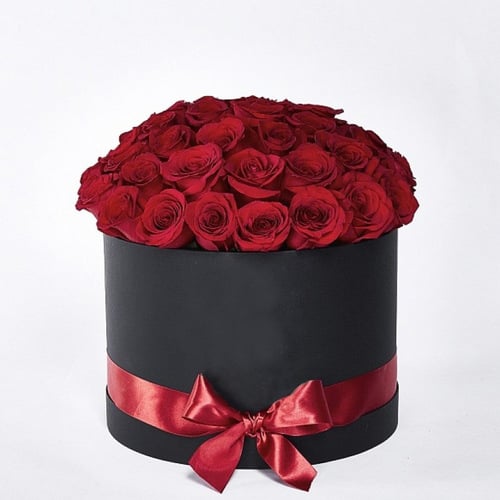 Red Roses In A Black Hat Box