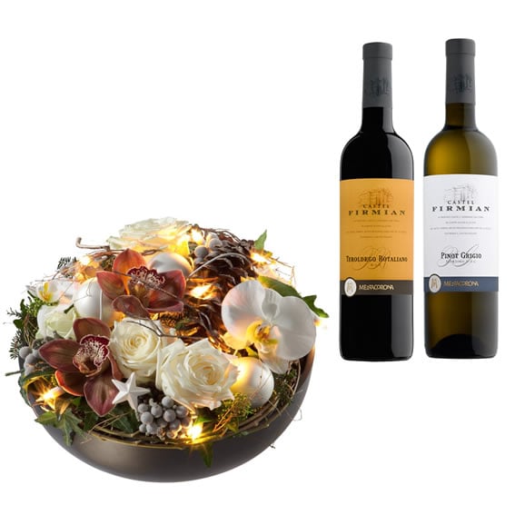 Christmas time arrangement with bottle of red and white wine