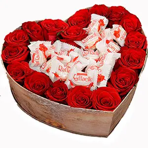 Heart of red roses and candies