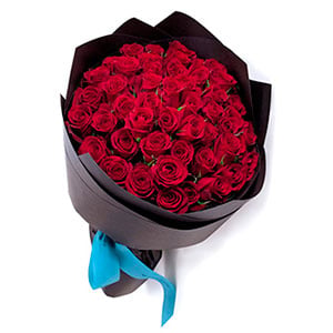 Bouquet of red roses in kraft paper