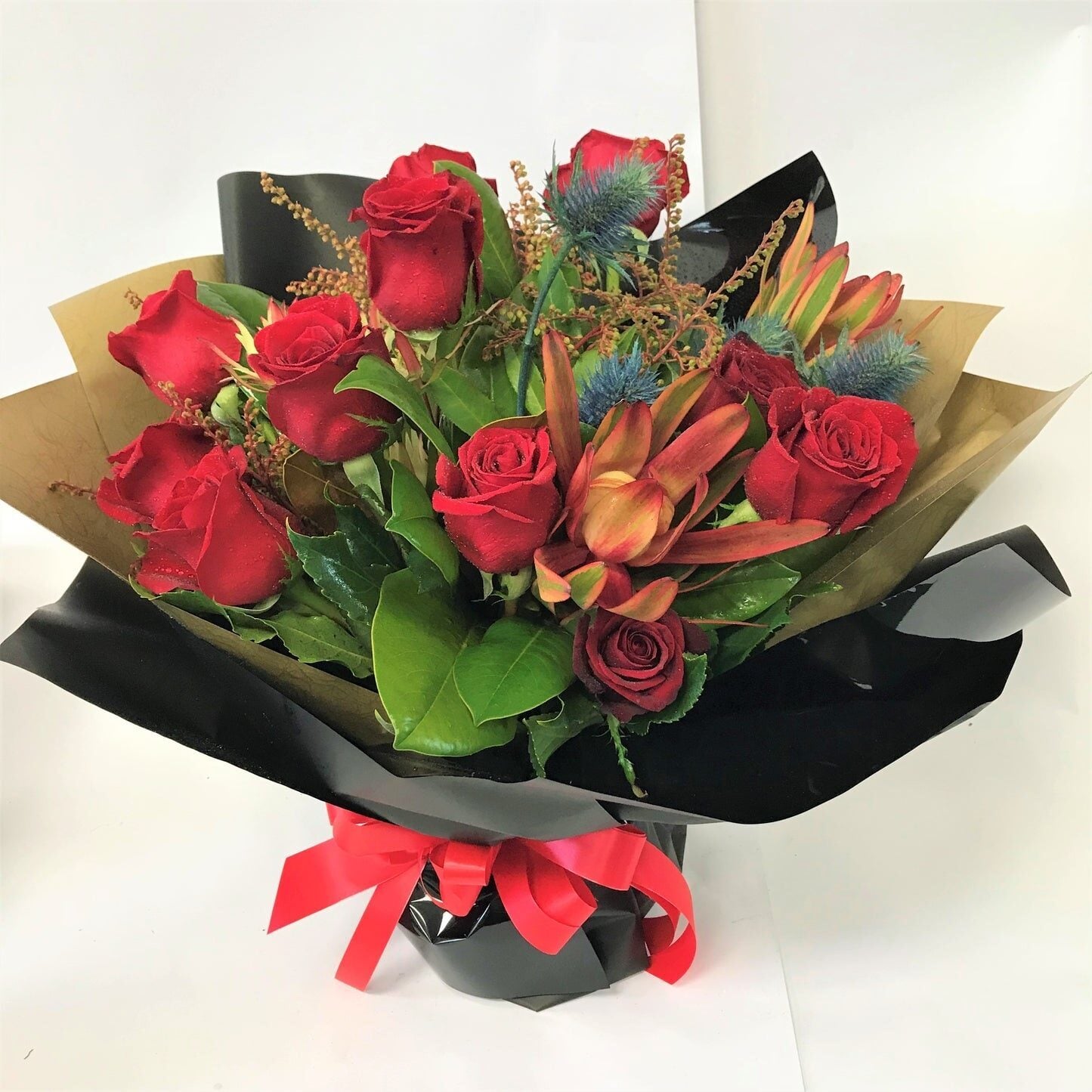 12 Romantic Red Roses with Other Foliage