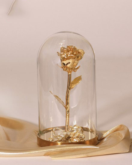 Golden rose in a flask