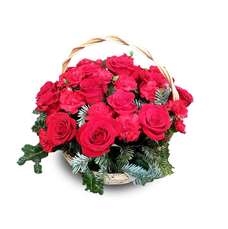 Flower arrangement of roses and carnations in a basket