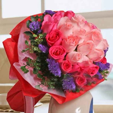 Round bouquet of 12 Peach and 21 Hot Pink Roses